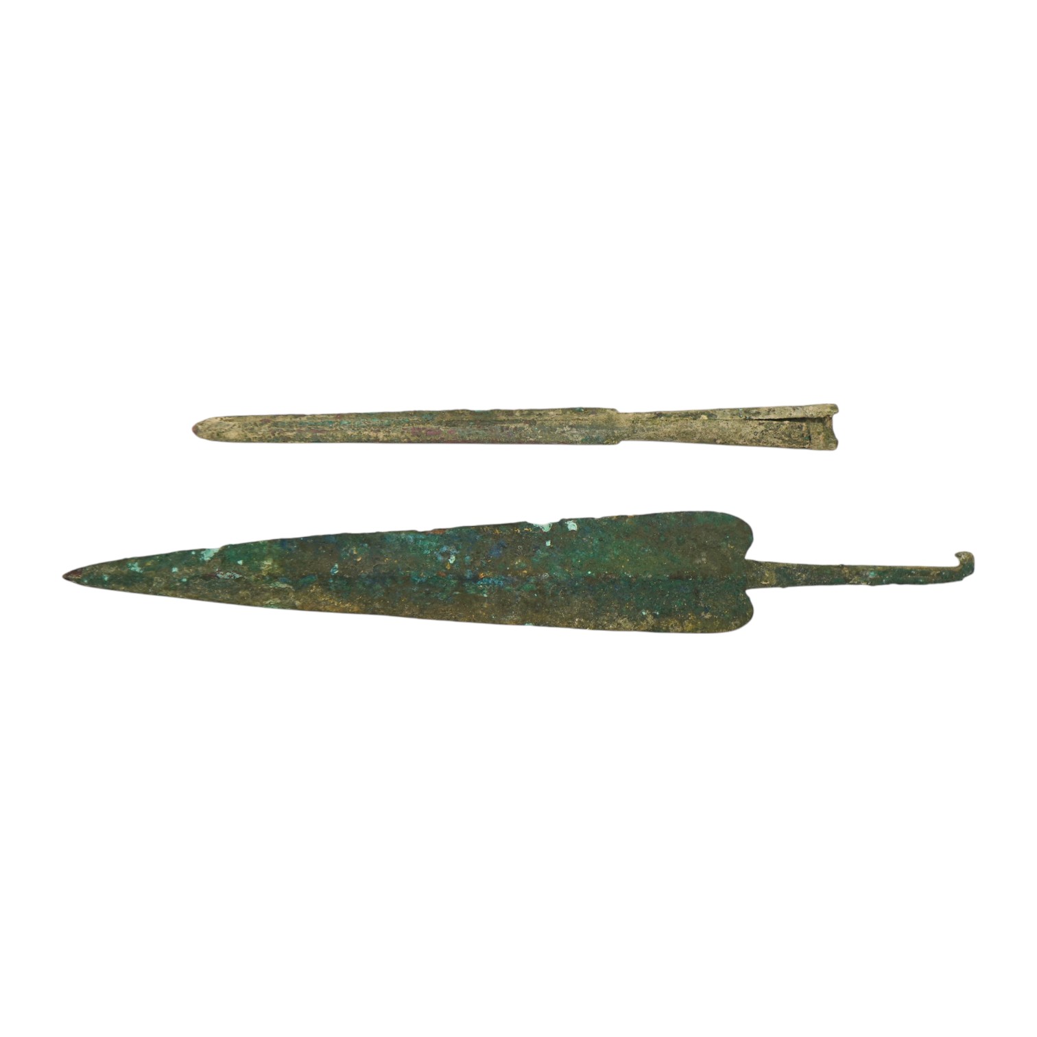 Two assorted Bronze Age spearheads, one of leaf shape with turned over tang, the other short with narrow blade. Condition - poor to fair.